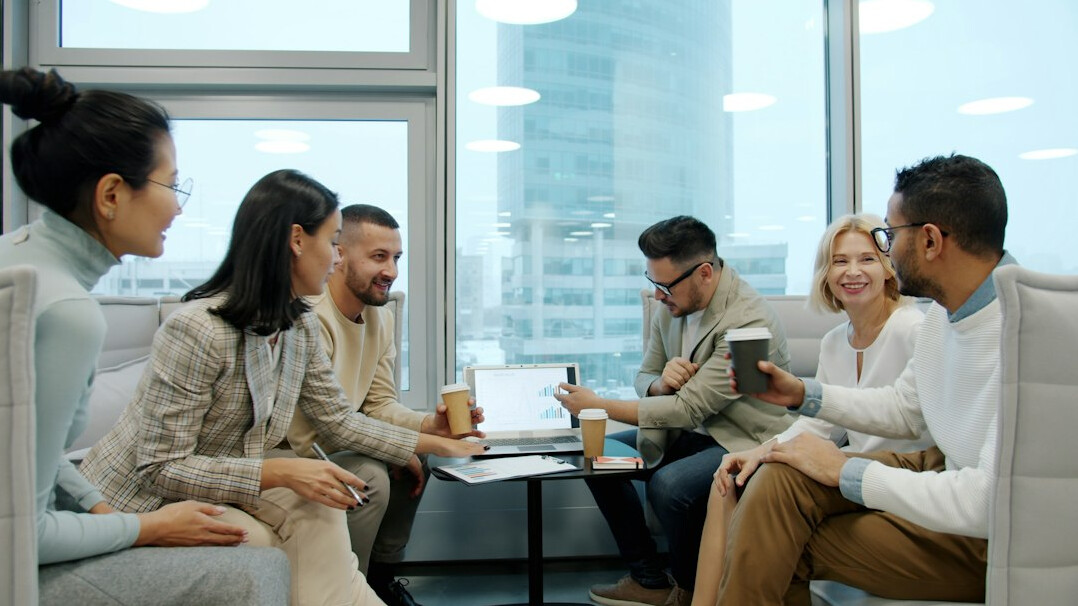 diverse group discussing at table