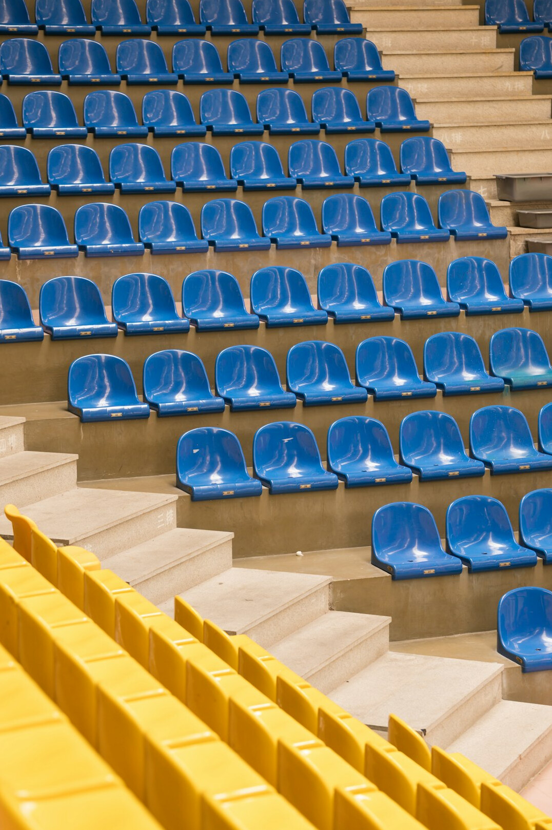 Rows of empty red velvet theater seats in an old European theater