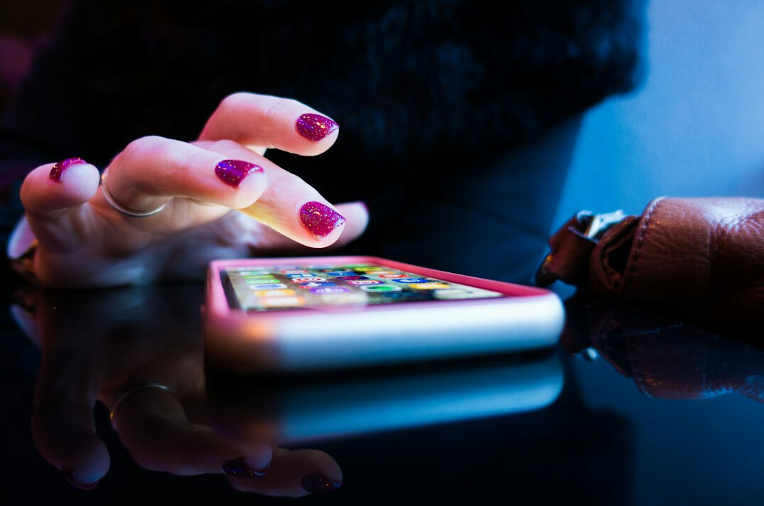 person scrolling on smartphone