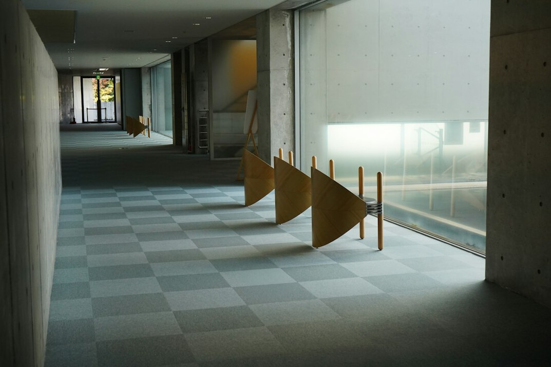 Minimalist museum corridor with soft lighting and empty gallery space